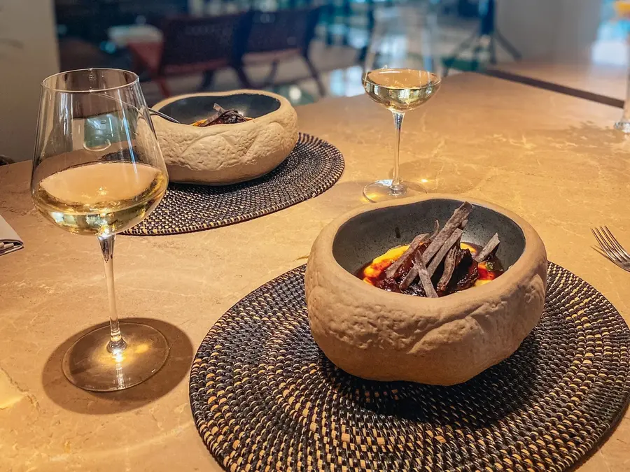 wine tastings in Mallorca – gourmet dish paired with a local wine at a top restaurant.